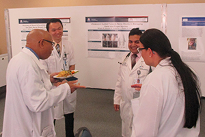 UA physicians discuss research posters at GME Scholarly Day South Campus
