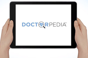 Doctorpedia onscreen with hands