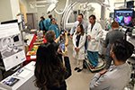 Drs. Matthew Hutchinson, Peter Ott and Julia Indik pose for photo during Electrophysiology Suite open hosue Sept. 13, 2018