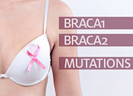 Midsection of woman with pink breast cancer awareness ribbon on her bra