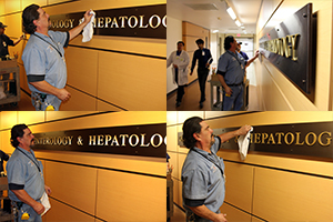 UA Facilities' Danny Rodriguez (blue shirt) and Adam Jacobs put finishing touches on new Division of Gastroenterology signage