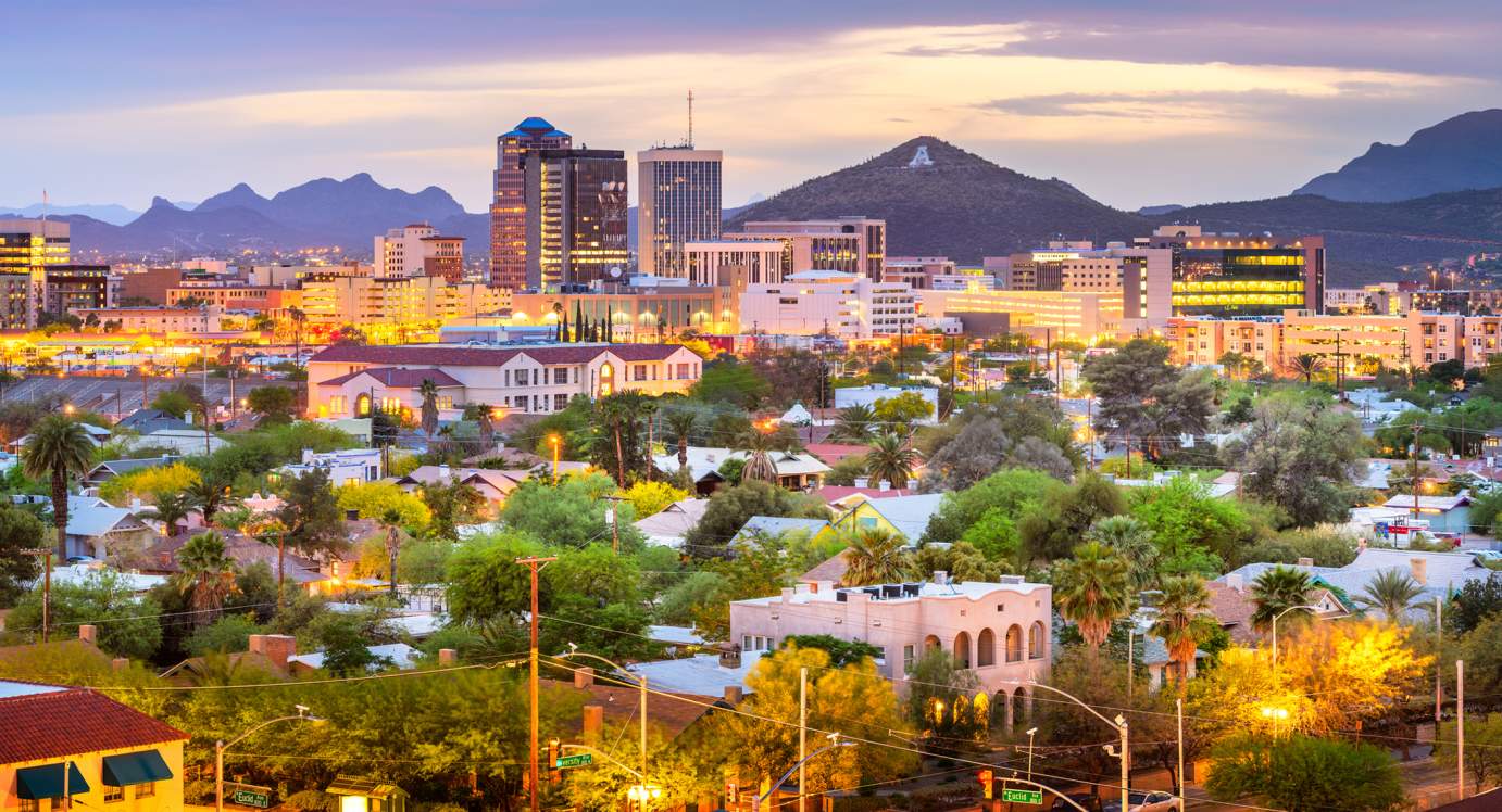 Image of downtown Tucson looking toward A Mountain at dusk as viewed from the University of Arizona.