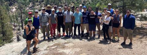 Group gathered on rocky plateau during hike - these are residents in the Internal Medicine Residency Program at the University of Arizona's Tucson campus.