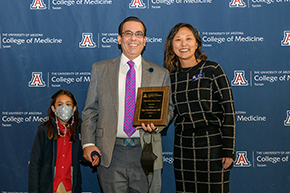 Honored for Clinical Excellence was Medicine’s Vijay Chandiramani, MD (center), associate chief of the Division of Inpatient Medicine, with his daughter and presenter Allie Min, MD, the college’s associate dean for career development.