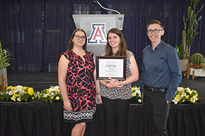 [DOM Finance colleagues Kaitlynn Perez, Courtney Smith (with framed certificate) and division manager Tera Bolton celebrate Smith’s nomination for the 2024 Lura Hanekamp Dedicated Staff Award of Excellence]