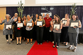 [Dr. Michael Abecassis, dean of the College of Medicine – Tucson (center), joins all the college's staff award of excellence nominees for a group photo, showing their Wildcat pride.]