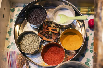 [Madhivanan makes a point of taking cooking classes and visiting food markets wherever she goes. She loves bringing home spices as souvenirs from her travels.]