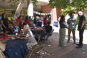 [Dr. Fransicso Moreno, at right, chats with José Luis Muñoz Jr., EdD, College of Medicine – Tucson DEI office director, and a colleague.]