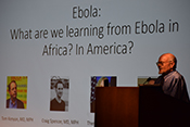 [Ebola panel discussion at DuVal Auditorium - with Dr. Ron Pust addressing audience.]