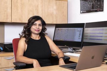 [Portrait of Rita Pandey, PhD, in her office at the University of Arizona Cancer Center]