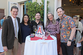 [A meet-and-greet before the 2024 DOM Awards Ceremony in the Arizona Inn's central courtyard, with Drs. Anthony Witten (behind far left), Kevin Moynahan, awardee Madhulika Banerjee (and guest), Amy Klein and Erick Brucks.]