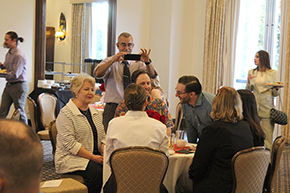 [Dr. J.P. Ferreira takes a photo of fellow faculty and staff for the Internal Medicine Residency Program, including Julie Forte, Dr. Laura Meinke (white blouse), Dr. Erick Brucks, Dr. Anthony Witten, Mary Gosciminski and Monica Jimenez.]