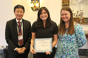 [Paulina Ashley Kuzmin, DO (center), winner of the Outstanding Resident in Endocrinology Award, presented by Endocrinology fellowship associate program director Dr. Sara Penquite (right) and DOM Chair Dr. James Liao (left).]