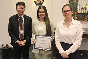 [Rebecca Wig, MBBS (center), winner of the Outstanding Resident Award for the Division of Pulmonary, Allergy, Critical Care & Sleep Medicine, with presenter Dr. Laura Meinke (right), a critical care specialist in the division, and DOM Chair Dr. James Liao (left).]