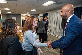 [Cellular & Molecular Medicine department chair Sakthivel Sadayappan, PhD, shakes hands with Division of Cardiology’s Christa Hamilton (shaking hands) and Mia Gonzales.]