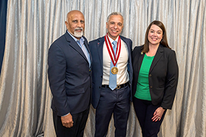 [Venkata “Bob” Evani, MD (left), CEO of Banner – University Medical Group and president of Banner Academics, and Allison Flynn Gaffney, FACHE, CEO of Banner – University Medical Center Tucson and South, congratulate College of Medicine – Tucson Cardiology division chief and Sarver Heart Center director Hesham Sadek, MD, PhD, on his investiture]