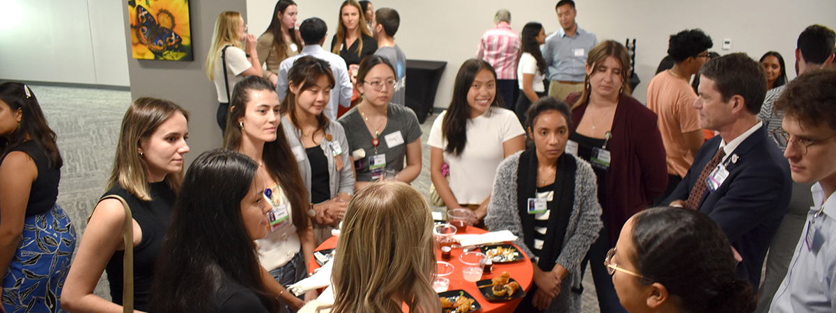 [Medical students, residents and others gather around the DOM’s Dr. Kevin Moynahan, vice dean for education at the College of Medicine – Tucson, at the Internal Medicine Student Meet-and-Greet, Sept. 11 in the COM-T Social Hall]