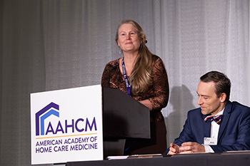 Dr. Monica Vandivort gives acceptance speech for AAHCM award.
