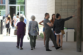 [Guests shuttle between the Spirit building and the Body building, also known as the Iris Cantor Building, during the public open house for the Andrew Weil Center for Integrative Medicine]