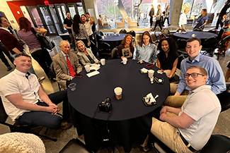 [Endocrinology faculty member Dr. Jennifer Stern (holding plaque) celebrates the recognition she received as recipient of the Basic and Translational Investigator Award.]