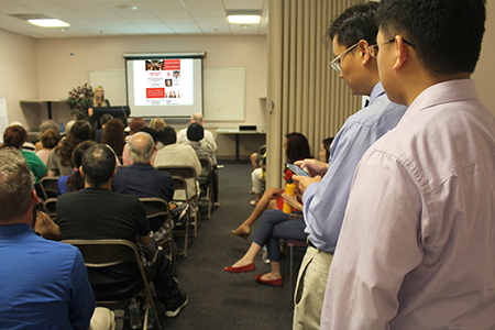 Dr. Jen-Jung Pan and colleague watch as nutritionist speaks at liver disease forum hosted at Banner - UMC Tucson on June 12