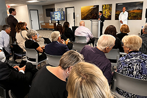 [Drs. Jim Liao and Joe Alpert, the current and a prior chair of the Department of Medicine, address attendees of memorial for the late Drs. Jim Dalen and Jay Smith, former dean and vice dean of the College of Medicine – Tucson, who died within weeks of one another. Both were on faculty in the DOM.]