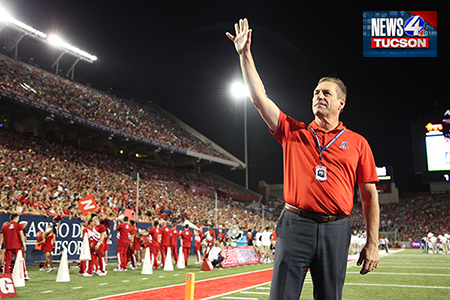 UA athletic director Dave Heeke waves to the crowds