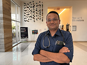 [Bijin Thajudeen, MD, a professor in the Division of Nephrology and one of two original DEI champions at the Department of Medicine, in the lobby of Banner – University Medical Center Tucson where he’s medical director for the inpatient dialysis unit.]