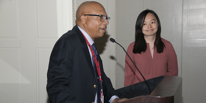 Eugene Trowers, MD, presents Kai Rou Tey, MD, with Outstanding Gastroenterology Resident Award