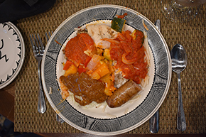 A plate of three varieties of ratatouille, traditional, spicy and curried, over rice, noodles and quinoa.