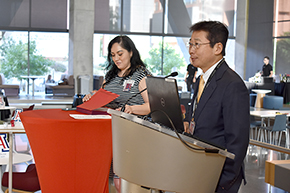 Photo of University of Arizona Department of Medicine Chair James K. Liao, MD, with Bersabe Lopez (on his left), offering comments at start of the department's 2023 Awards Ceremony.