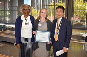 Elise Le Cam, MD (center, holding certificate), winner of the 2023 Outstanding Resident in Gastroenterology and Hepatology Award, with Gastroenterology Division Chief Juanita Merchant, MD, PhD, and Department of Medicine Chair James Liao, MD.