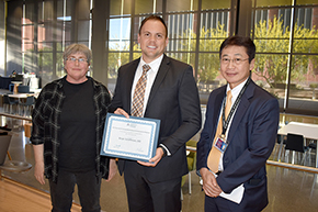 Brian Schiffman, DO (center), winner of the 2023 John T. Boyer Award for Outstanding Resident in Geriatrics, with Julie Jernberg, MD, director of the department’s Health & Societies Thread and Ambulatory Medicine Clerkship, and Department of Medicine Chair James Liao, MD.