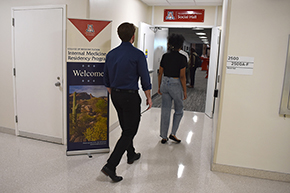 [A medical student enters the COM-T Social Hall for the Internal Medicine Student Meet-and-Greet hosted Sept. 11, 2024, by the Intennal Medicine Residency Program at the College of Medicine – Tucson.]