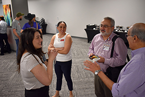 [Infectious Diseases’ Dr. Tirdad Zangeneh (right) and Nephrology chief Dr. Bekir Tanriover chat with Dr. Rosemarie Terk, a PGY-2 resident, and Nephrology Fellowship coordinator Bersabe Lopez.]