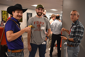 [PGY3 IM resident Skyler Trieu (left) sports his cowboy hat and boots to match up with IM Residency associate program director J.P. Ferreira (right).]