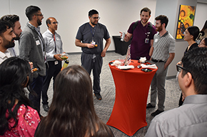 [Allergist Dr. Puneet Shroff (4th from left), who also is a Societies Mentor, draws a big circle at the Internal Medicine Student Meet-and-Greet event hosted by the IM Residency Program.]