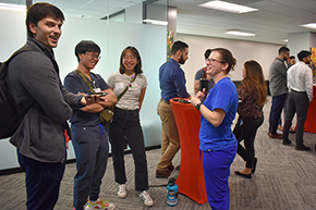 [IM Residency Program director and critical care specialist Dr. Laura Meinke (in blue scrubs) paints a picture of what her work and residency are like for medical students, including Jacob Ref (far left). ]