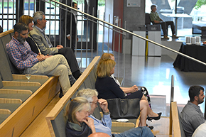 Dr. Neil Ampel (upper left) and others listen to Quentin Boyer tell stories about his father, Dr. Jack Boyer