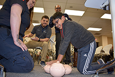 Drs. Orta and Ainapurapu watch Dr. A's son learn CPR