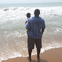 Dr. Bailey with his second child, Makeda, a daughter. “She was about 6-months-old. We’re in Benin on the Ouidah Beach. This is where my father-in-law is from and also the site from where the largest transportation of captured African slaves were taken away from Africa. We were standing there watching the spot from where many of my ancestors were brought to America.” 