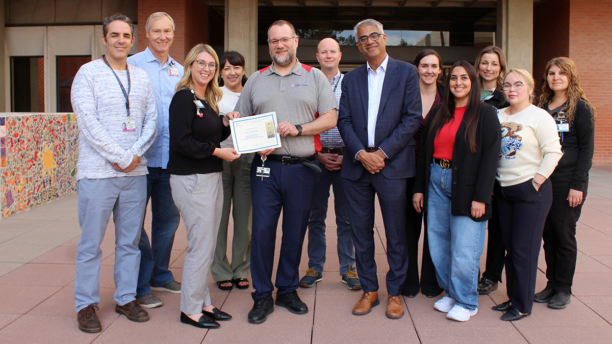 [Pictured (from left): Jarrod Mosier, MD, Critical Care Medicine Fellowship associate director; Steven Knoper, MD, Lung Transplant medical director; Beth Draves, RN, senior director & associate CNO for Banner hospitals in Tucson; Brenda Lambert;  Josh Malo, MD; David Miller, MD, associate director, Pulmonary & Critical Care Medicine and Critical Care Medicine fellowships; Sai Parthasarathy, MD, chief, Pulmonary division; Amy Napier; Jacque Carrillo; Brittany Anundson; Monique Murillo; and Hossai Shah.]