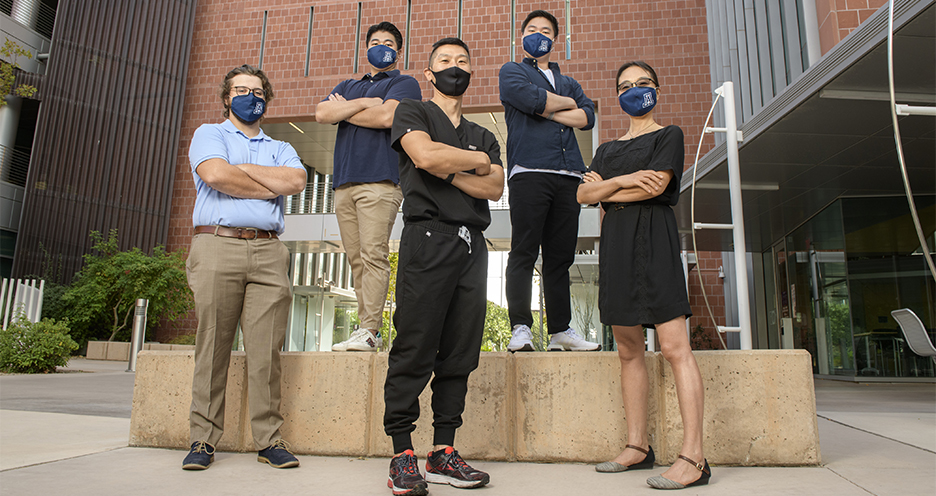 Dr. Eugene Chang (middle back) with his lab staff: Joey Irish, Ray Lee, Eric Lee and Sunny Palumbo outside the Medical Research Building on the UArizona Health Sciences Campus in Tucson. (Photo: Kris Hanning/University of Arizona Health Sciences)