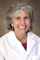 Mindy J. Fain, MD, in white physician's coat