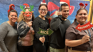 [2023 GI Holiday Photo Booth debut, with (from left) Maria Longoria, Claudia Rosales, Stephanie Clinch, Cameron Thompson, MD, and Carmen Ramos.]