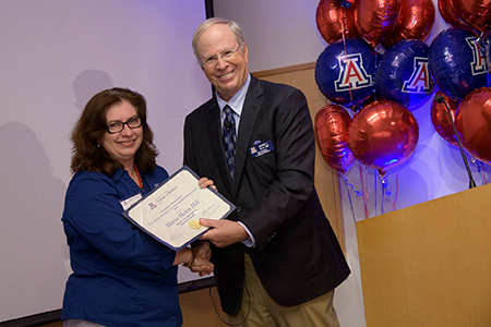 Pulmonary Fellowships Manager Helen Hill receives certificate from Irv Kron, interim executive dean, UA College of Medicine – Tucson