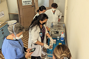 [Staff at the Hospital Clínico Viedma in Cochabamba, Bolivia, prepare for rounding.]