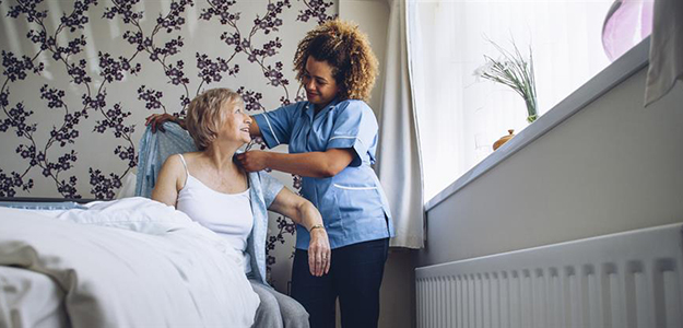Home-based primary caregiver cares for patient