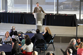 [COM-T vice dean and GGP Division’s Kevin F. Moynahan, MD, at the podium, introduces the first set of Faculty Award winners.]