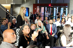 [Jennifer Plitt, MD, a palliative medicine and emergency medicine specialist in the GGP division, approaches the stage after her name was called for a Vernon & Virginia Furrow Excellence in Teaching Award.]